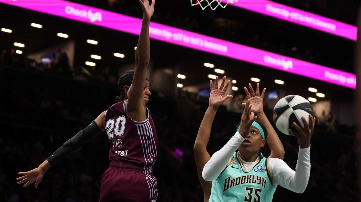 New York Liberty center Jonquel Jones (35) goes up for a shot against Toronto Tempo guard Brittney Sykes (20) during the first half of a WNBA basketball game, Wednesday, June 3, 2026, in New York.
