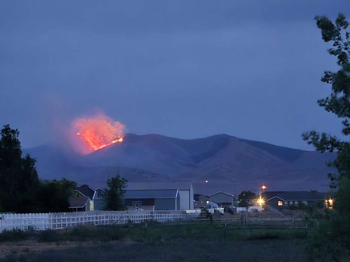 A fire burns on South Mountain in Tooele County on Monday night.