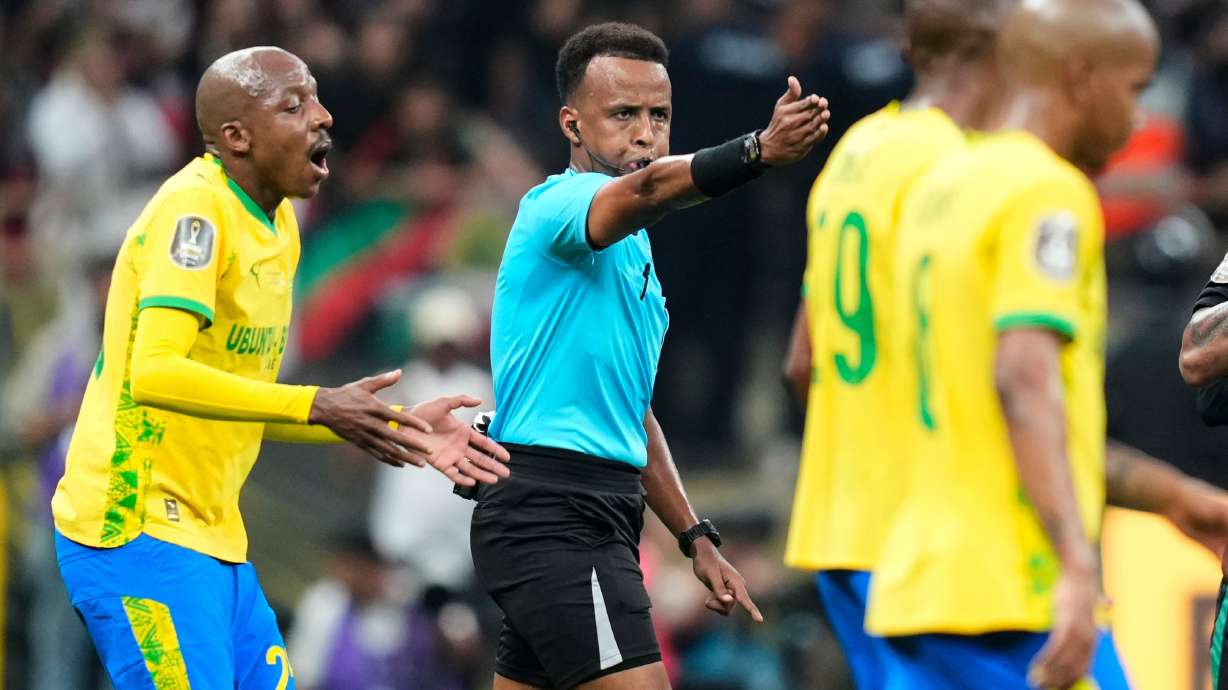 FILE - Referee Omar Artan, center, signals a penalty during the CAF Champions League final soccer match between AS FAR Rabat and Mamelodi Sundowns, in Rabat, Morocco, Sunday, May 24, 2026.
