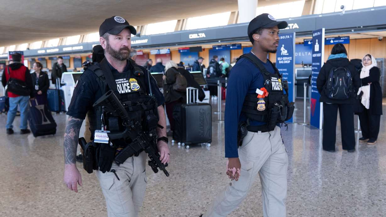 Federal Air Marshals patrol around Washington Dulles International Airport, in Chantilly, Va., March 24. The House passed a $70 billion bill to fund immigration enforcement on Tuesday.