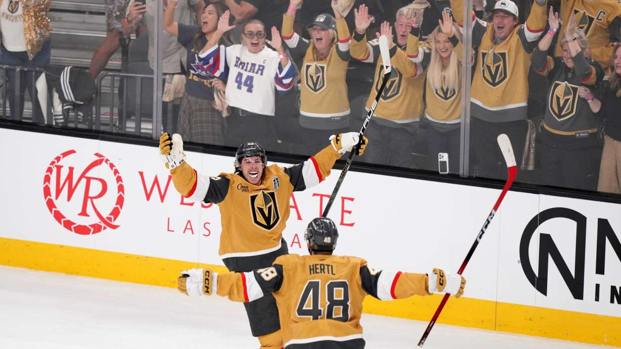 Vegas Golden Knights right wing Mitch Marner, top, celebrates his goal with center Tomas Hertl during the second period in Game 3 of the NHL hockey Stanley Cup Final series against the Carolina Hurricanes, Saturday, June 6, 2026, in Las Vegas.