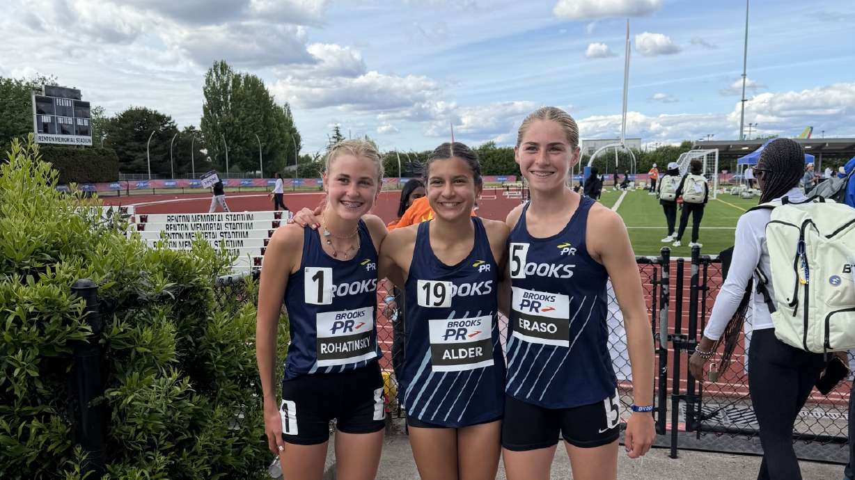 Thirteen-year-old Angelina Alder, center, broke the middle school mile record with a time of 4:38.25 at the Brooks PR Invitational in Renton, Washington, over the weekend. She thanked her teammates, Oaklie Rohatinsky, left, and Sydney Eraso, right, for pushing her.