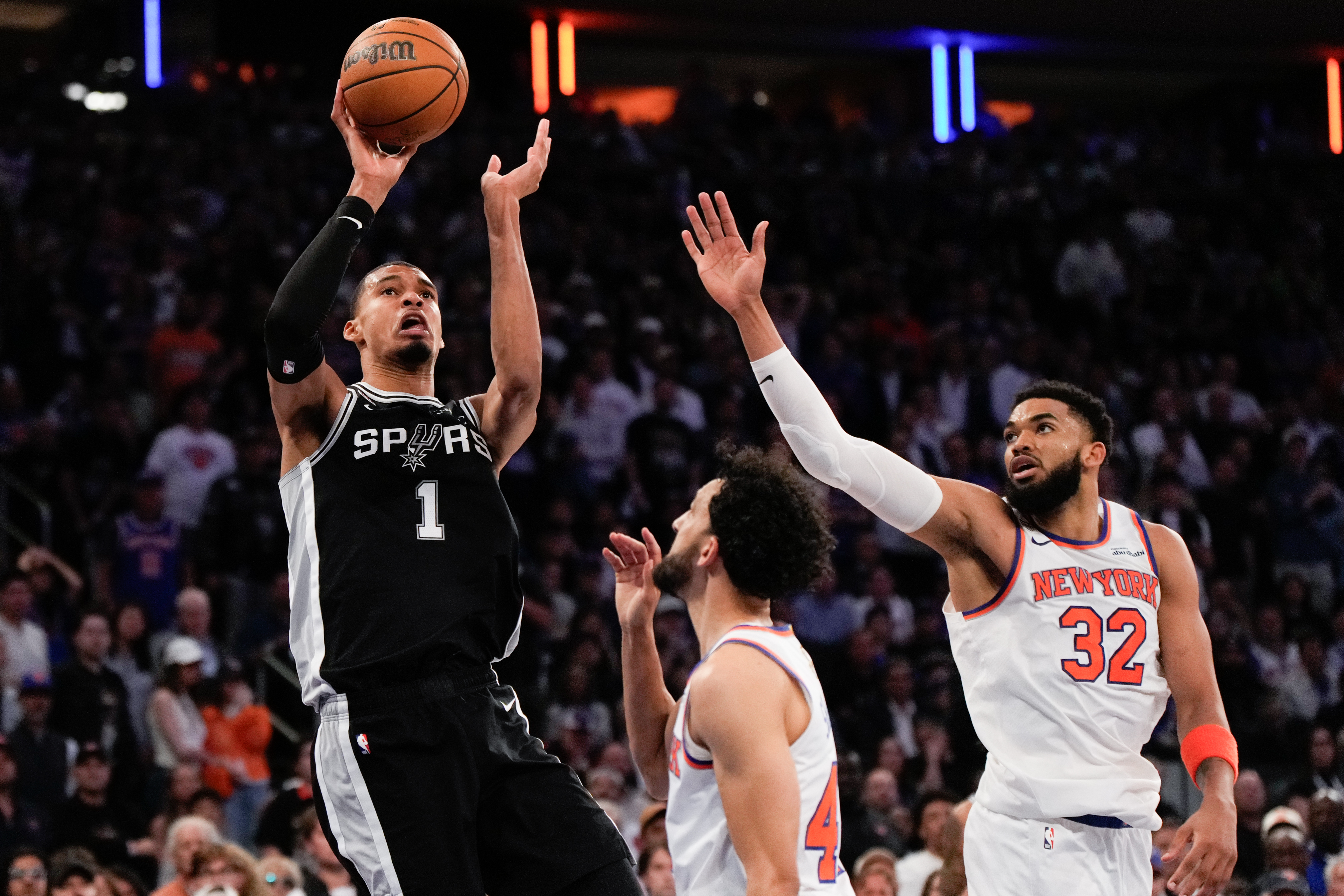 San Antonio Spurs forward Victor Wembanyama (1) shoots over New York Knicks center Karl-Anthony Towns (32) during second half of Game 3 of the NBA Finals basketball series, Monday, June 8, 2026, in New York.