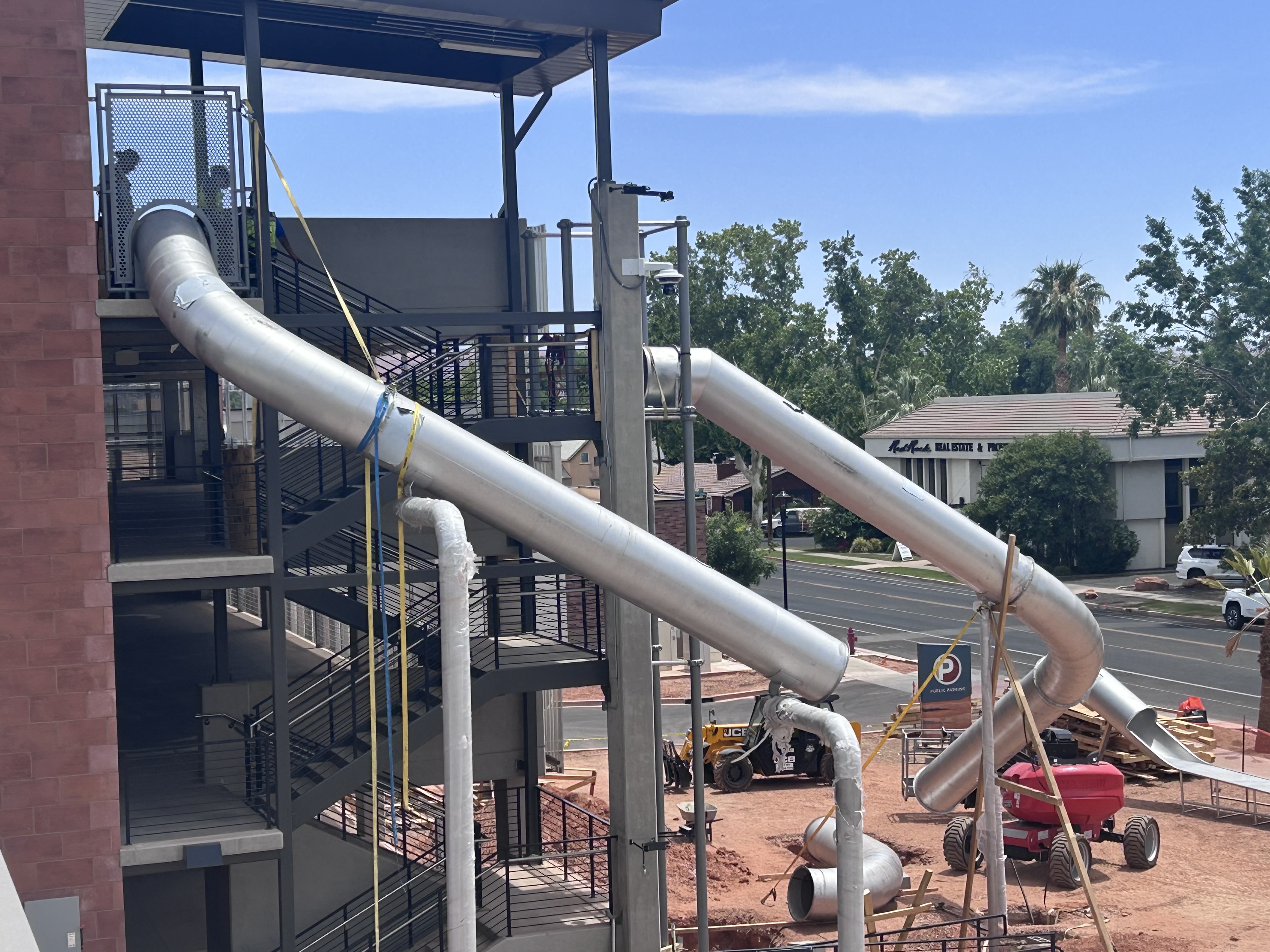 2 massive, stainless-steel slides at City Hall Plaza in St. George aim to bring families downtown
