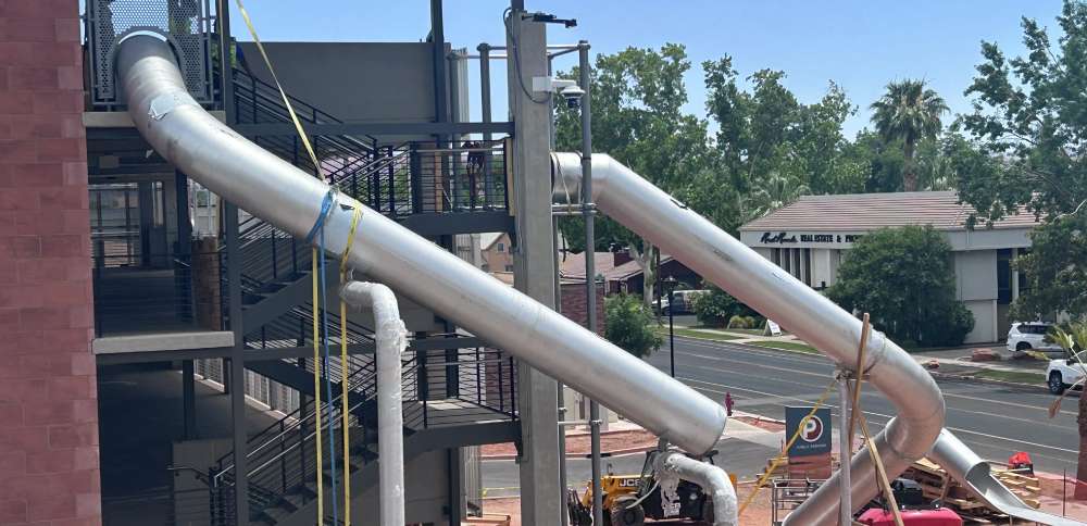 2 massive, stainless-steel slides at City Hall Plaza in St. George aim to bring families downtown