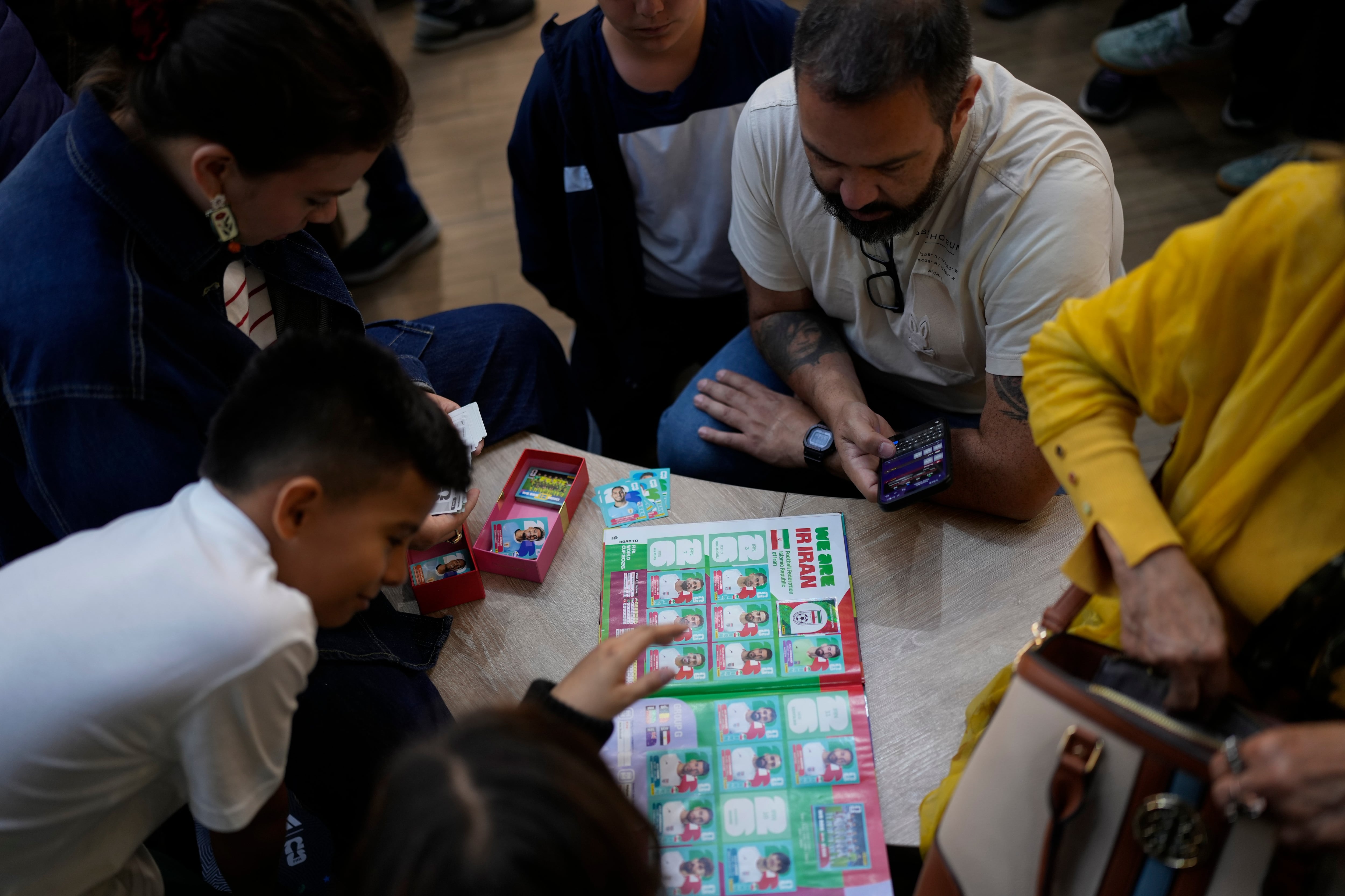 People gather at a shopping center to exchange collectible stickers for the 2026 FIFA World Cup soccer album in Bogota, Colombia, May 28. The popular sticker album has been a worldwide tradition since 1970.