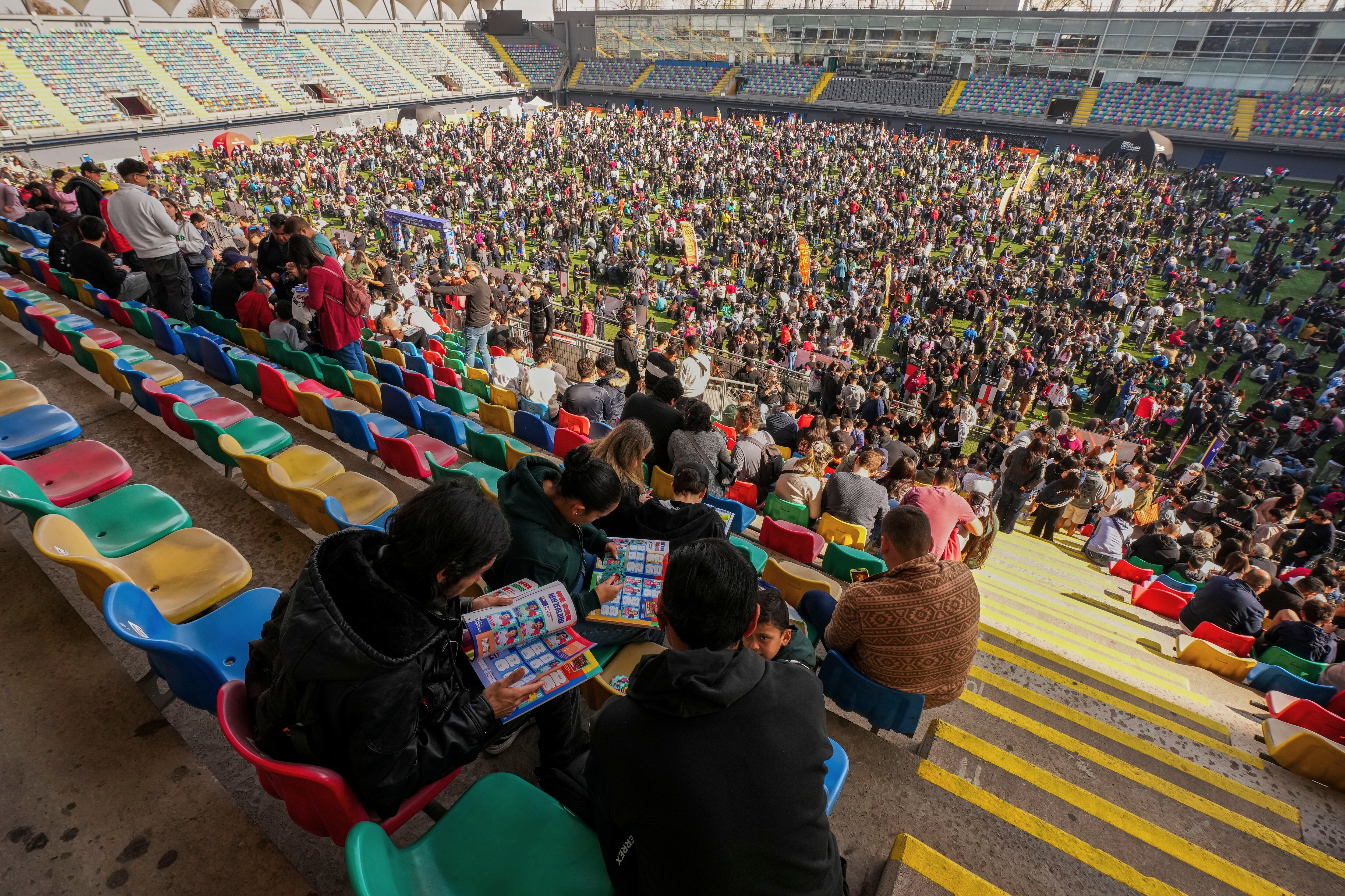 Soccer fans gather to trade Panini World Cup sticker albums and trading cards at the Bicentenario de La Florida stadium in Santiago, Chile, May 31. The popular sticker album has been a worldwide tradition since 1970.