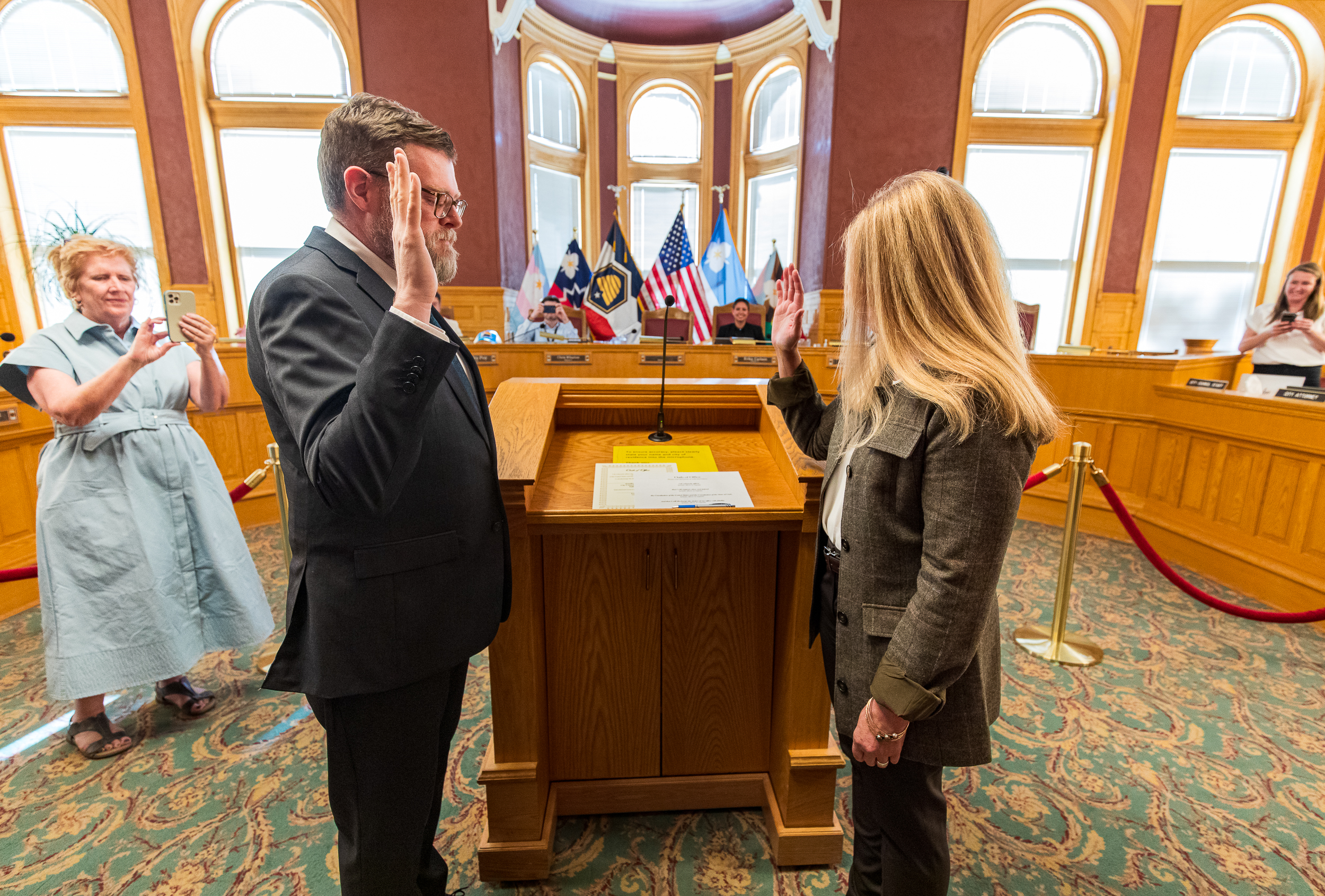 Salt Lake City recorder Keith Reynolds, left, swears in Jennifer Napier-Pearce after a Salt Lake City Council special election Tuesday evening. Napier-Pearce won the seat through a coin flip.