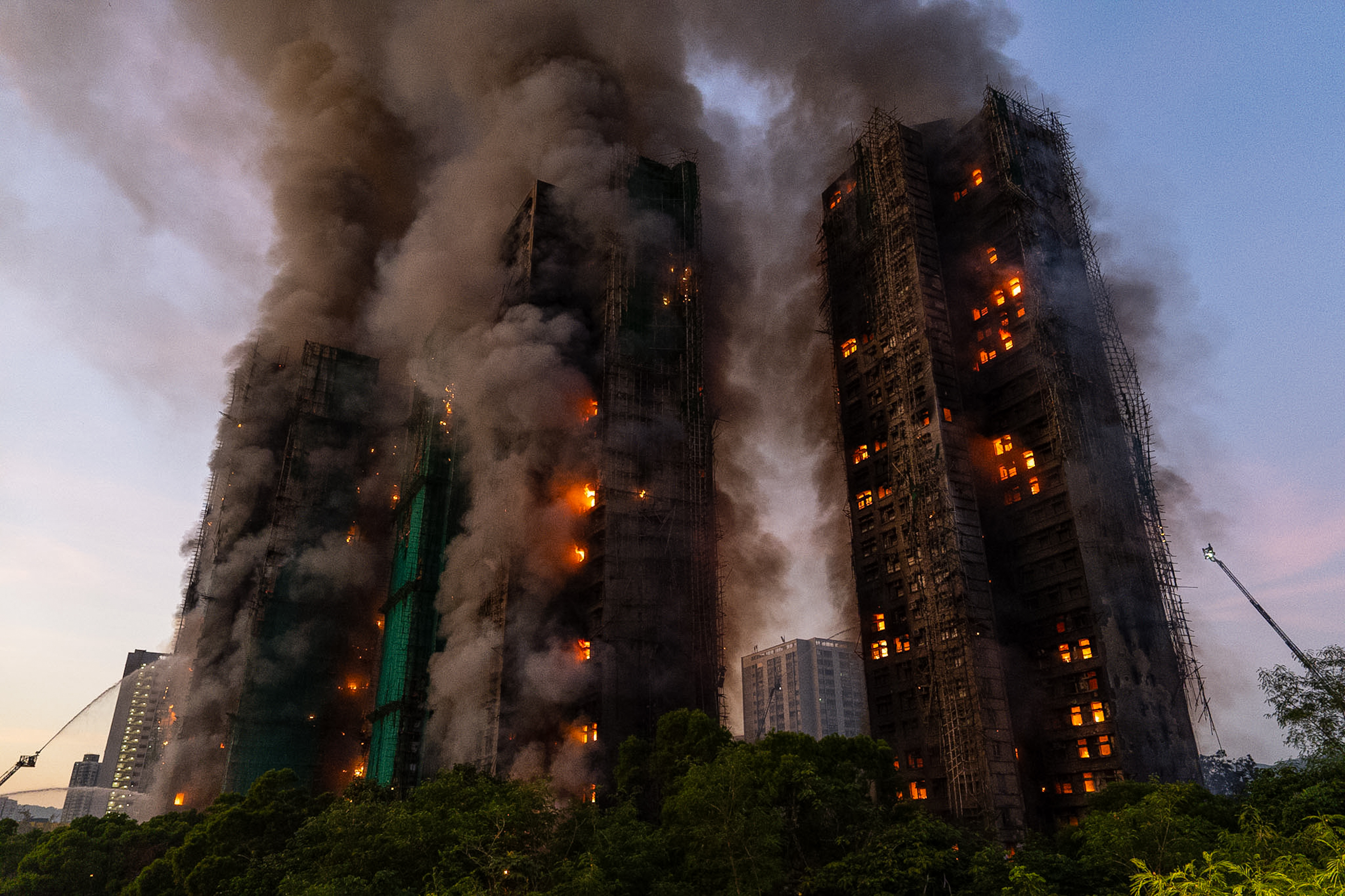 Hong Kong charges 7 people and 2 firms over massive fire that killed 168