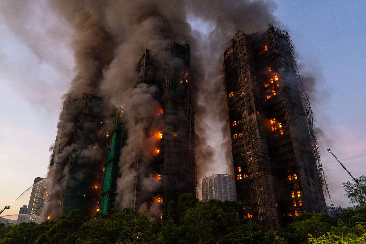 Smoke rises after a fire broke out at Wang Fuk Court, a residential estate in the Tai Po district of Hong Kong's New Territories, Nov. 26, 2025. Hong Kong released its final report on the fire on Thursday.