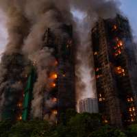 Hong Kong charges 7 people and 2 firms over massive fire that killed 168
