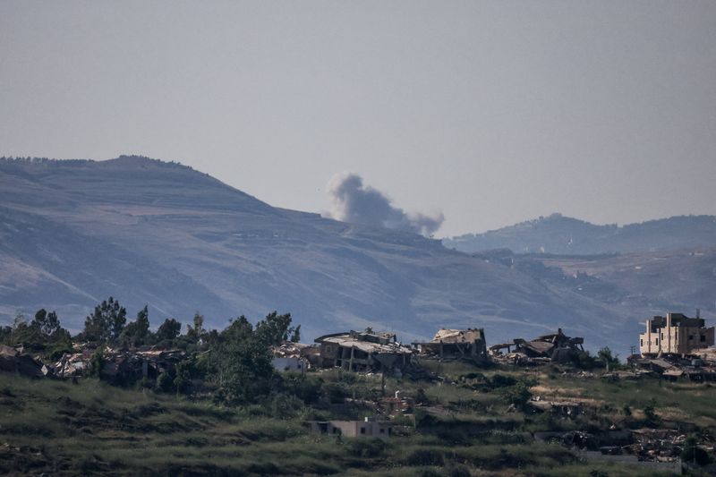 Smoke rises in southern Lebanon following an explosion, as seen from the Israeli side of the Israel-Lebanon border, in northern Israel, Wednesday. The parallel war in Lebanon is continuing as Iran and the U.S. continue to trade strikes.