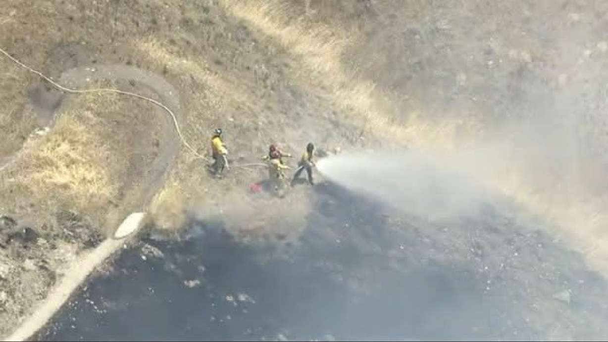 Firefighters attack the Sandhurst 2 Fire in Salt Lake City on Wednesday. The cause of the fire is still unknown.