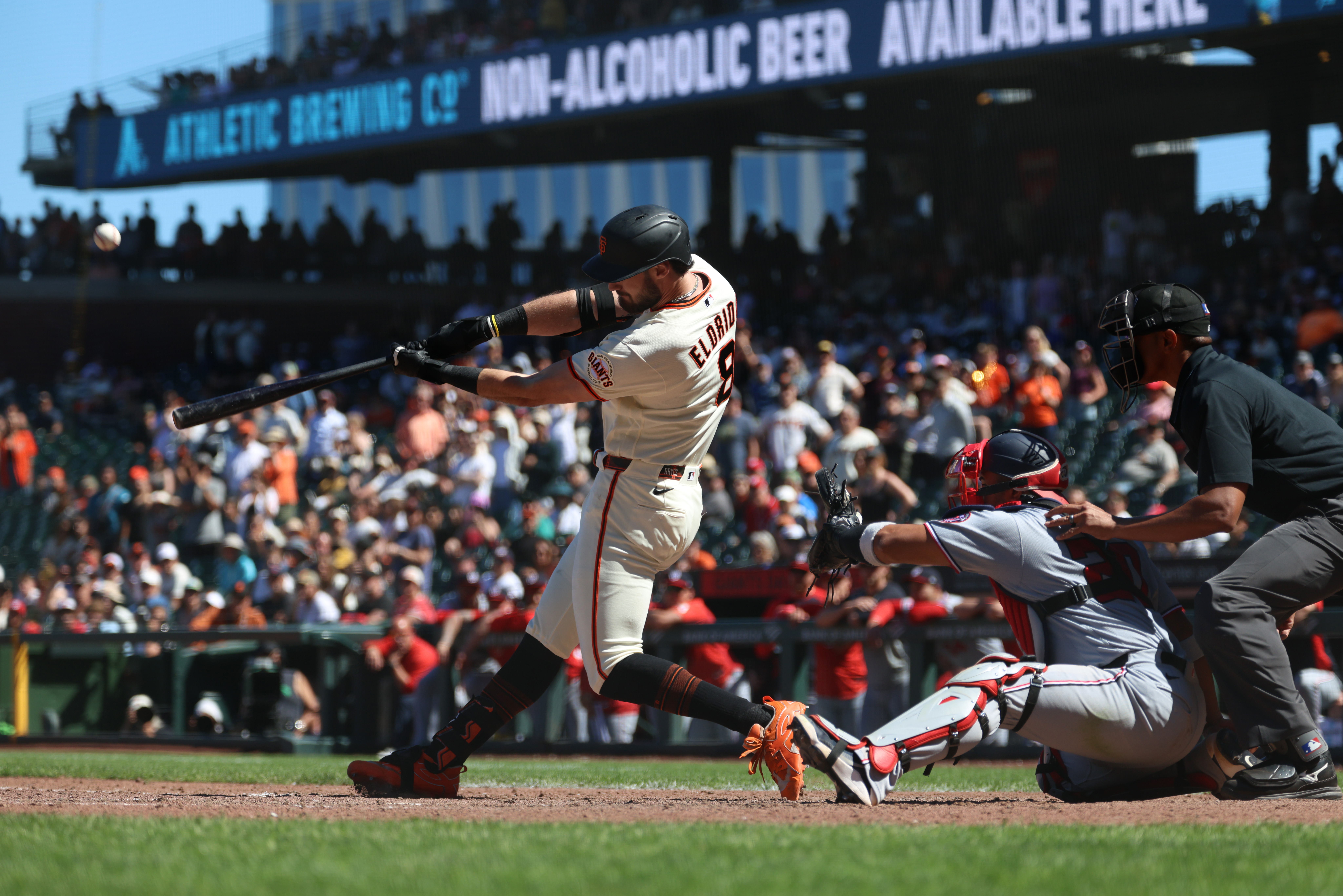 San Francisco Giants' Bryce Eldridge hits a grand slam in front of Washington Nationals catcher Keibert Ruiz during the ninth inning of a baseball game in San Francisco, Wednesday, June 10, 2026.