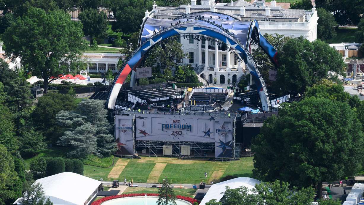 Workers continue building the stage for a future UFC fight on the South Lawn of the White House in Washington, Tuesday, June 9, 2026.