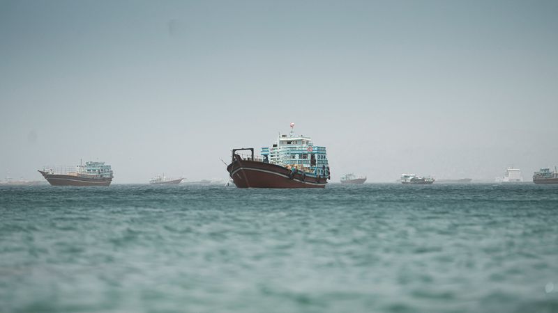 Vessels sail through the Strait of Hormuz, Musandam, Oman, May 20. Iran responded to U.S. strikes by closing the strait, which U.S. Central Command denied late Wednesday.