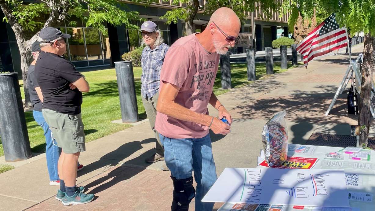 A smattering of demonstrators protested on Wednesday outside the Utah offices of the state's four U.S. House members after President Donald Trump inked an immigration bill into law. Protester David Belnap is pictured at a demonstration in Ogden.