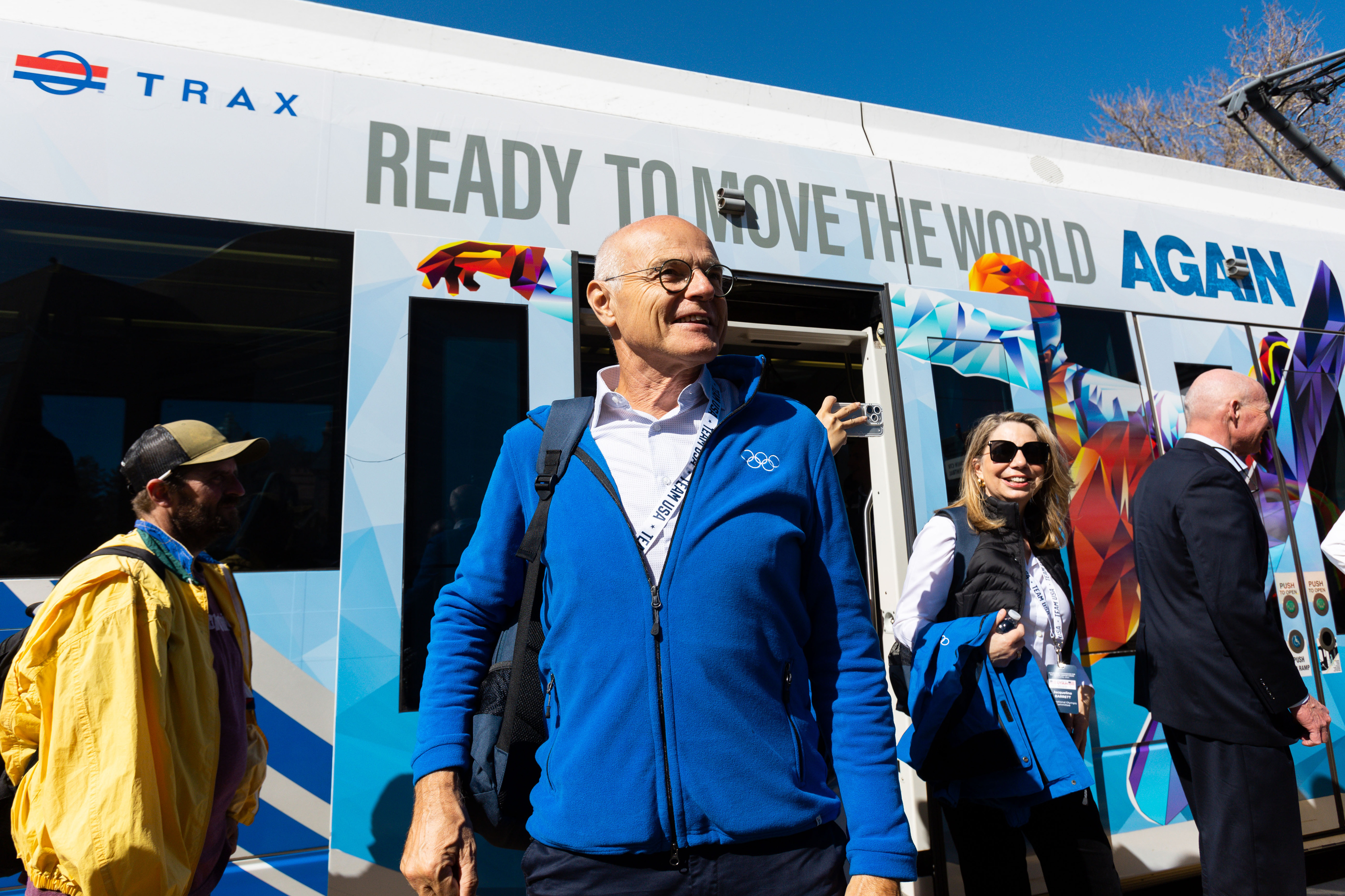 Karl Stoss, Future Host Commission for the Olympic Winter Games chair, steps off a TRAX vehicle wrapped in Olympic imagery at the Arena TRAX station outside of the Delta Center on April 10, 2024. Stoss said summer sports could be added to the 2034 Winter Olympics in Utah.