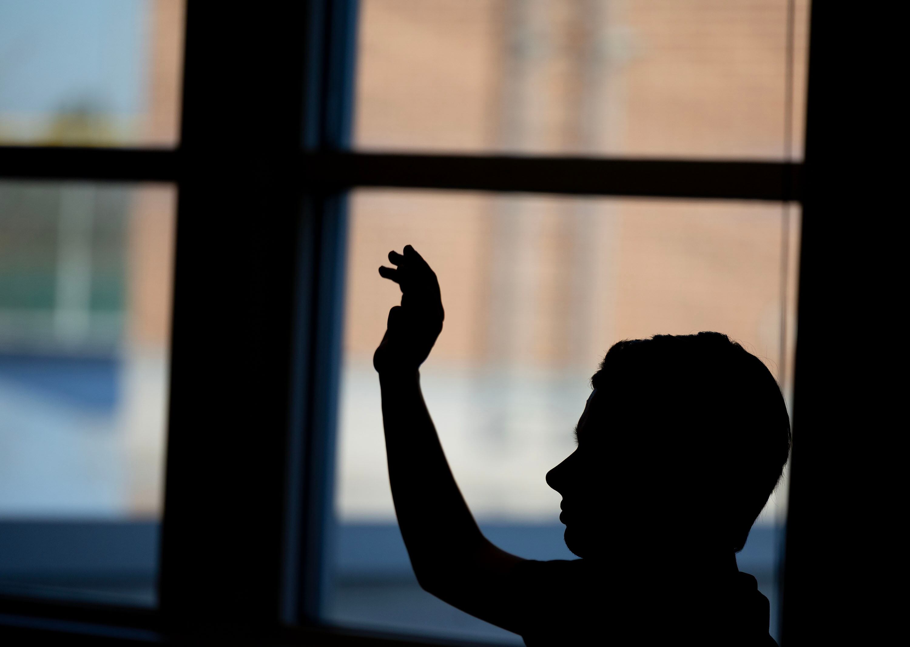 A student raises their hand at Jordan High School in Sandy on Jan. 15.