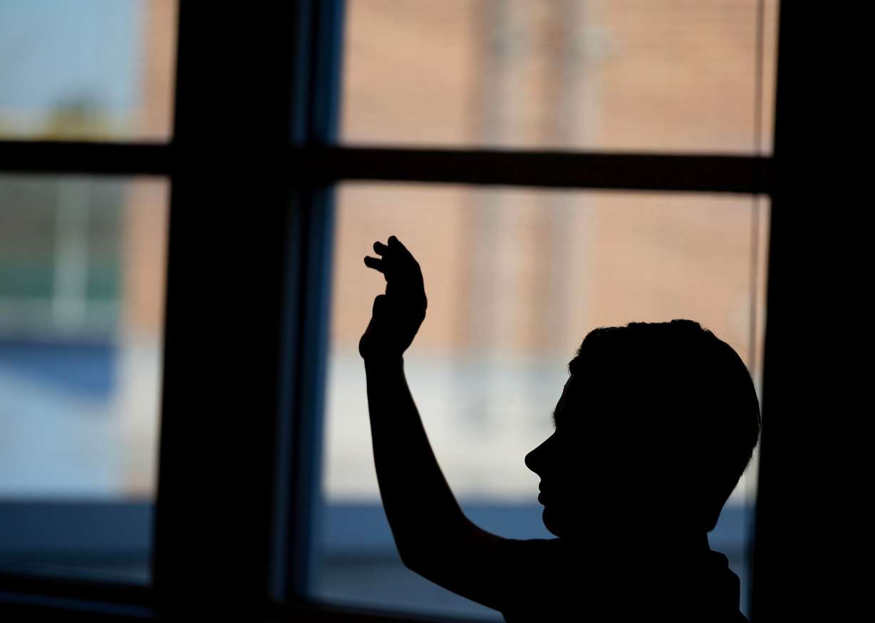 A student raises their hand at Jordan High School in Sandy on Jan. 15.