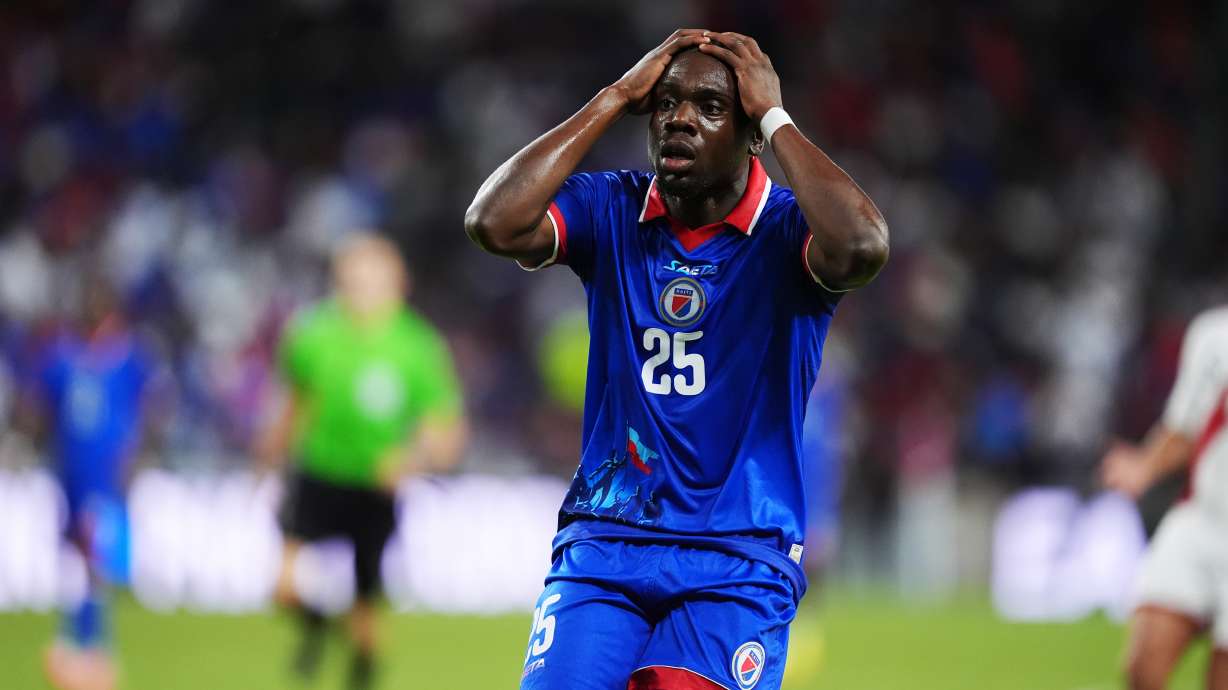 Haiti midfielder Dominique Simon reacts following an unsuccessful scoring attempt during the second half of an international friendly soccer match against Peru, Friday, June 5, 2026, in Miami.