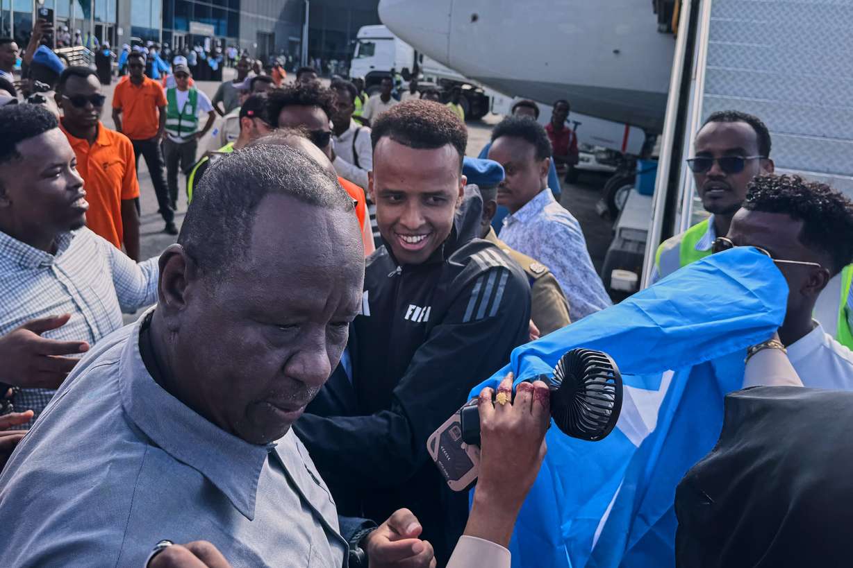 Referee Omar Artan, who was denied entry to the United States, is welcomed by supporters upon his arrival in Mogadishu, Somalia, Wednesday. The International Olympic Committee expressed confidence on Thursday that the same issues plaguing internationals heading to the FIFA World Cup would not happen at the 2028 Summer Olympics.