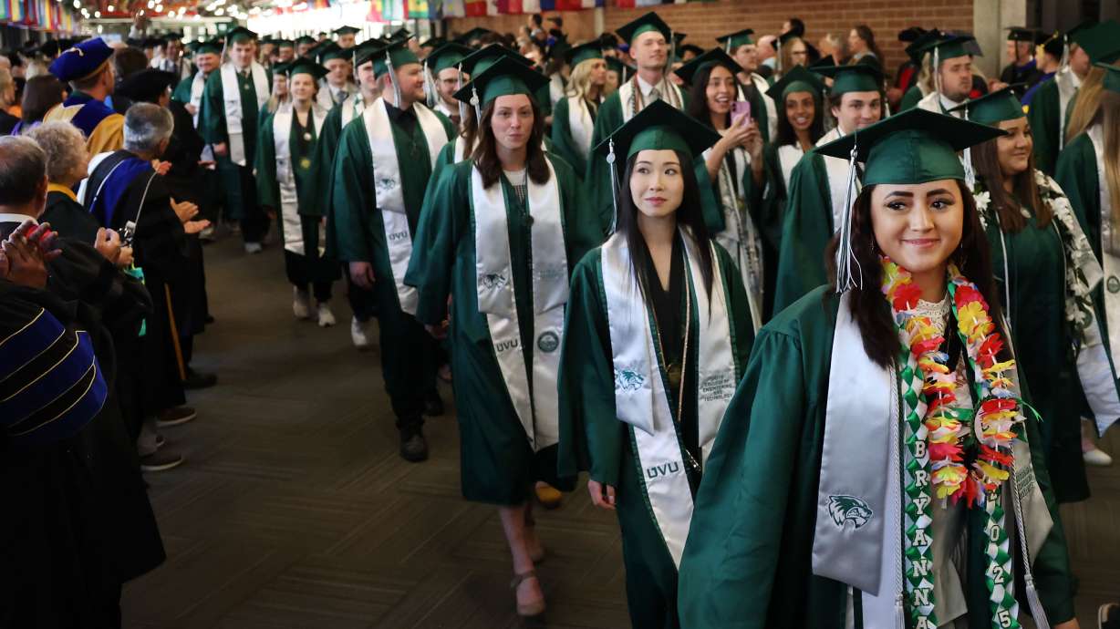 Utah Valley University graduates walk at Utah Valley University in Orem on April 30, 2025. UVU was one of the institutions on Thursday to update the Board of Higher Education on its ongoing budget reallocations.