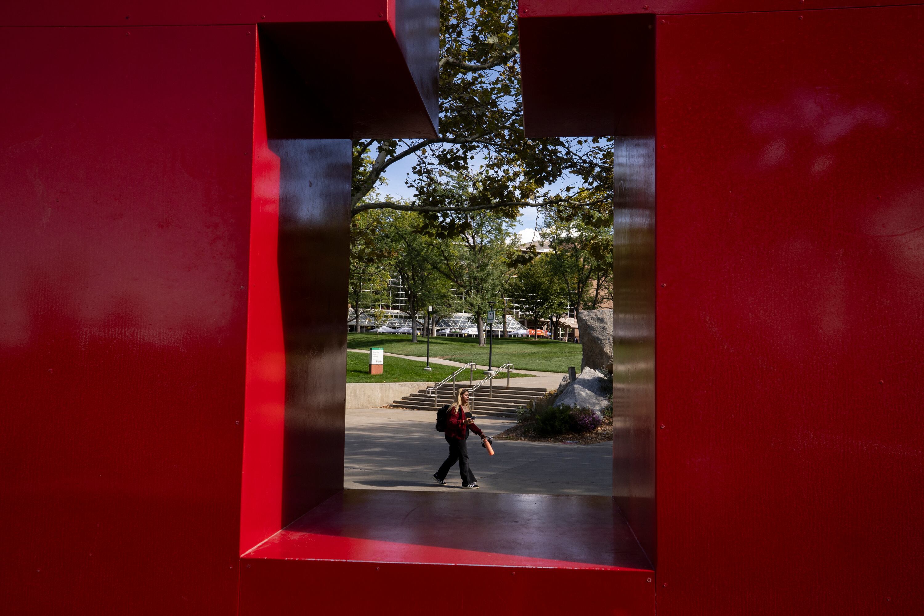A student walks past the U sculpture on the University of Utah campus in Salt Lake City on Sept. 26. The school told the state Board of Higher Education on Thursday it is increasing its net reinvestment in instruction to $5.9 million.