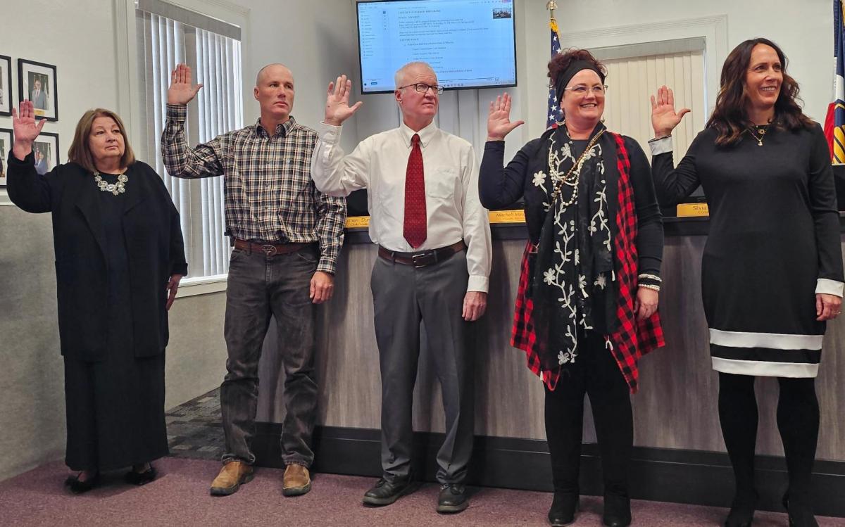 San Juan County Assessor Rick Meyer, in the center and wearing a red tie, in 2025. The Utah State Tax Commission on Thursday recommended Meyer's removal from office.