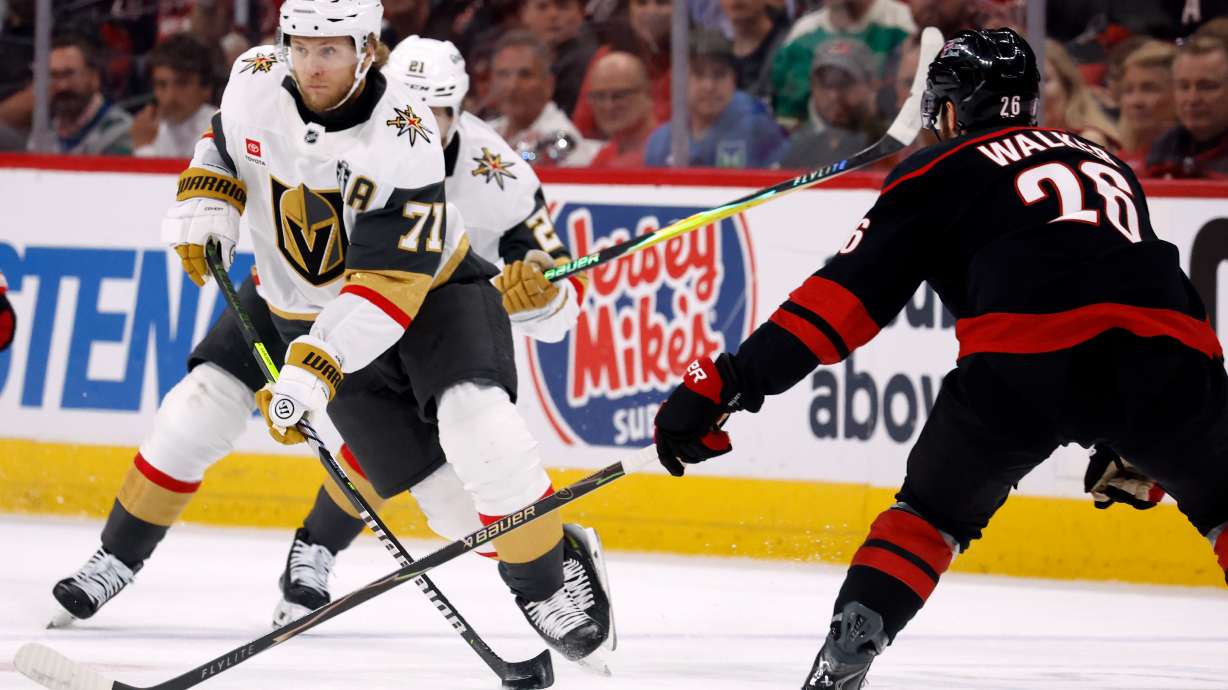 William Karlsson (71) moves the puck around Carolina Hurricanes' Sean Walker (26) during the first period in Game 5 of the NHL hockey Stanley Cup Final series in Raleigh, N.C., Thursday, June 11, 2026.