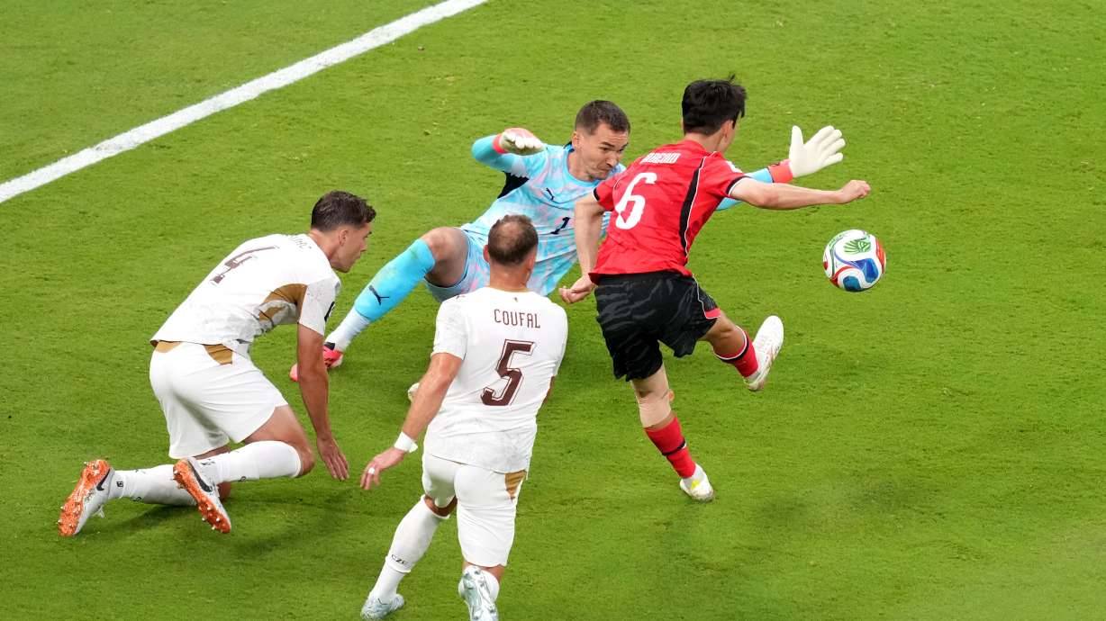 South Korea's Hwang In-beom, right, shoots and scores a goal against Czechia goalkeeper Matej Kovar during the World Cup Group A soccer match between South Korea and Czechia in Zapopan, near Guadalajara, Mexico, Thursday, June 11, 2026.
