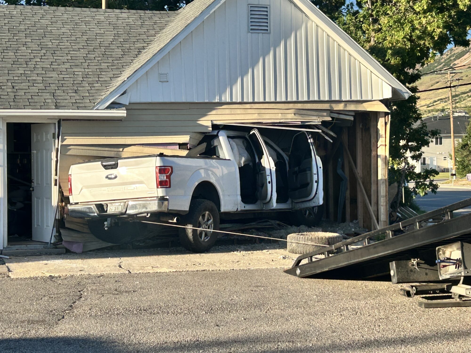 Mother and baby escape serious injury after truck slams into Perry home