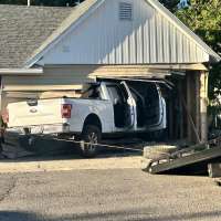 Mother and baby escape serious injury after truck slams into Perry home