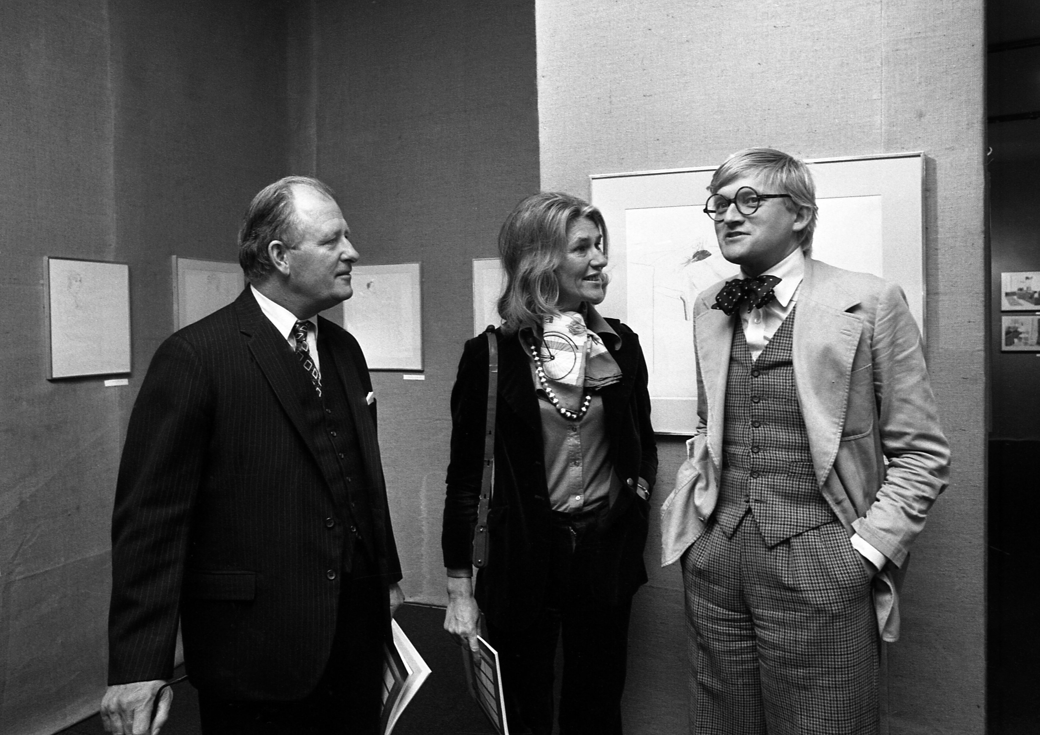 Painter David Hockney with British Ambassador Edward Tomkins at the opening of his exhibition at Musee des Arts Decoratifs on Oct. 10, 1974, in Paris. Hockney died on Thursday at the age of 88, his publicist said on Friday.