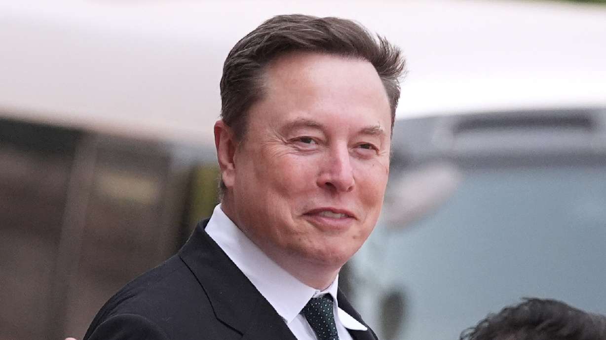 Elon Musk departs after a welcome ceremony with President Donald Trump and China's President Xi Jinping at the Great Hall of the People, May 14, in Beijing.