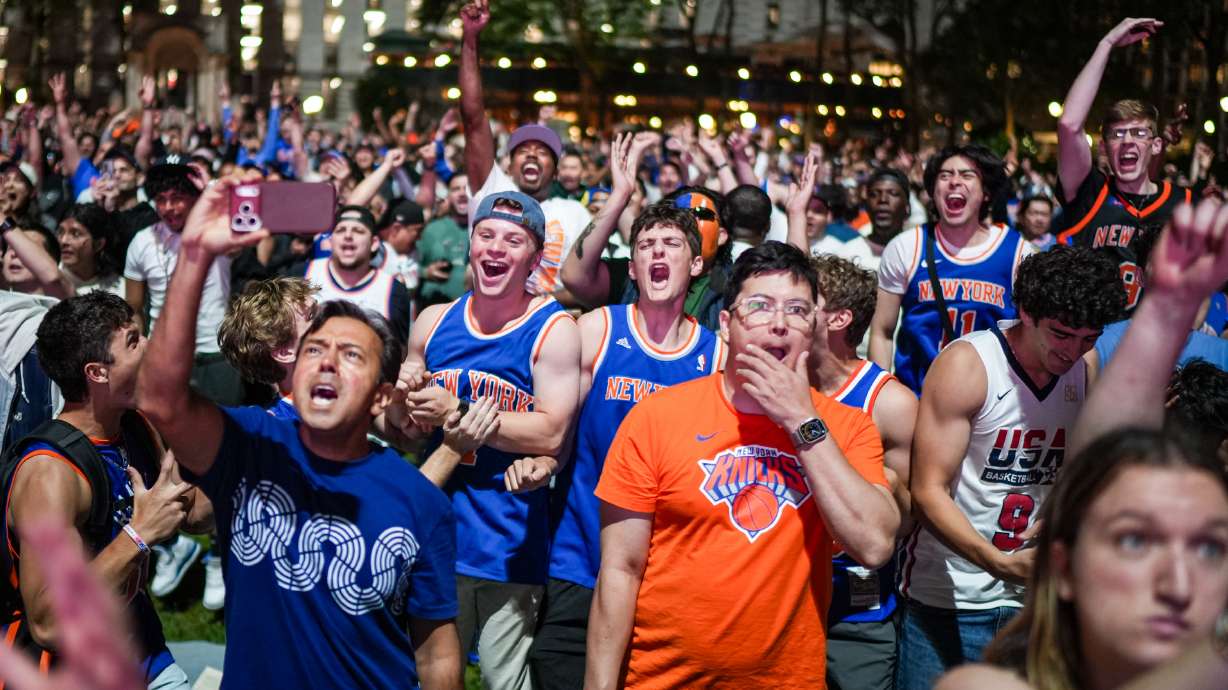 New York Knicks fans cheer at a watch party during Game 3 of the NBA Finals basketball series between the Knicks and the San Antonio Spurs, Monday, June 8, 2026, in New York.