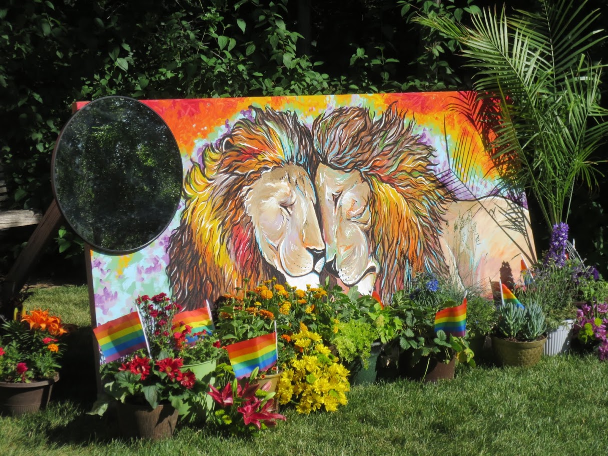 Artist Alyssa Cumpton created the mural “We Are One” as a play on words to a pride of lions for the 2025 Blooming with Pride exhibit at Red Butte Garden.