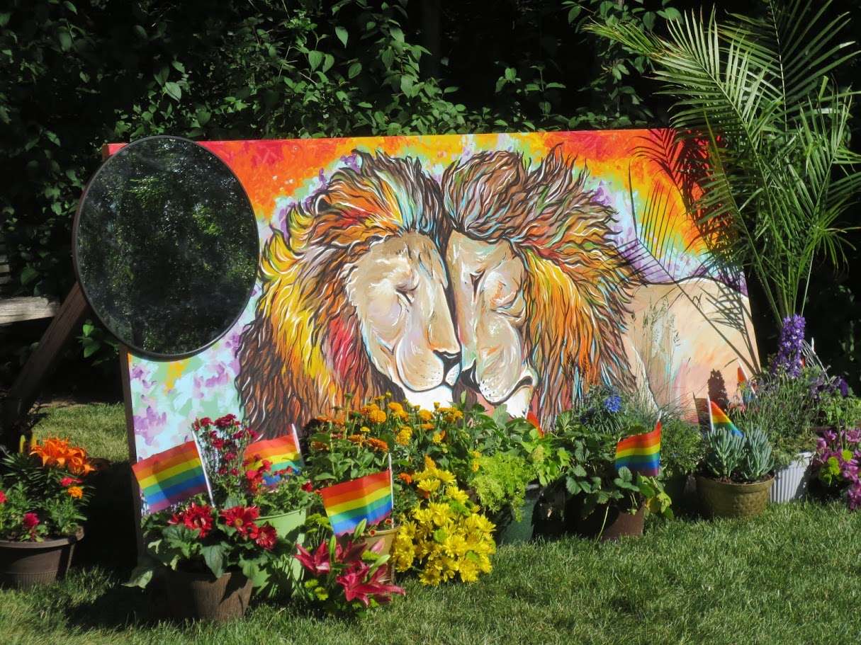 Artist Alyssa Cumpton created the mural “We Are One” as a play on words to a pride of lions for the 2025 Blooming with Pride exhibit at Red Butte Garden.