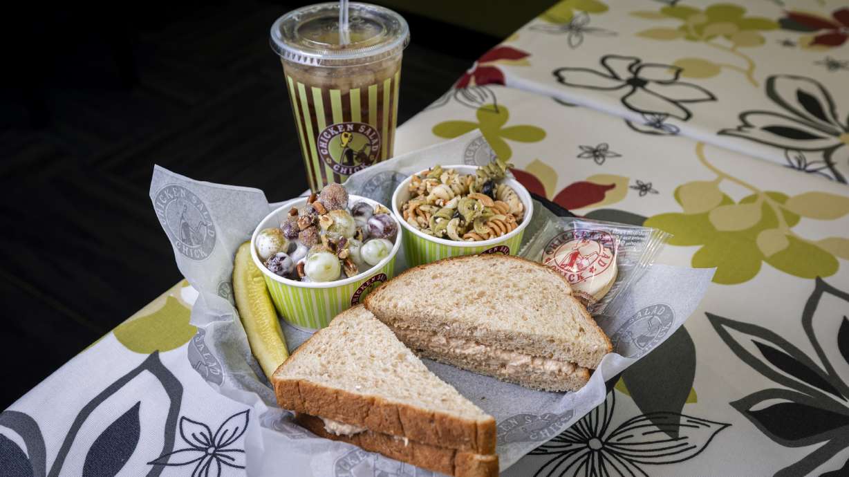 A sandwich meal comprised of a sandwich with Barbie Q chicken salad, a mini frosted cookie, a side of pasta salad, a side of grape salad and a sweet tea are pictured at Chicken Salad Chick’s location in Pleasant Grove on Thursday.