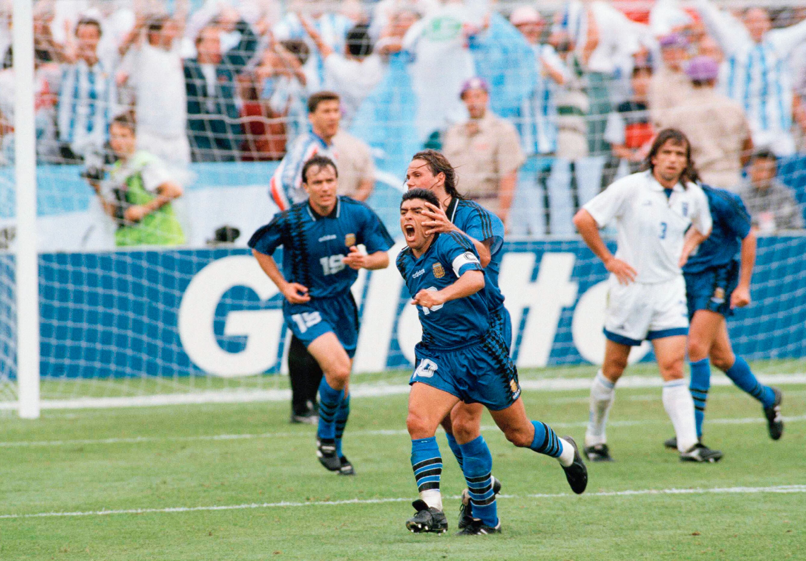 Argentina's Diego Maradona (10) is hugged by teammate Fernando Redondo after scoring a goal against Greece during a first round Group D World Cup soccer match, Tuesday, June 21, 1994, in Foxborough, Mass.