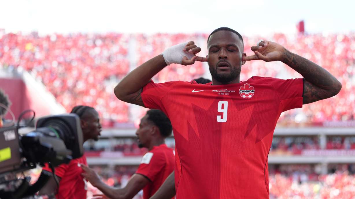 Canada's Cyle Larin (9) celebrates after scoring his sides first goal of the game in the second half of the World Cup Group B soccer match between Canada and Bosnia, Friday, June 12, 2026, in Toronto.