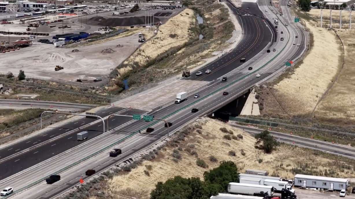 Crews work on I-215 West in Salt Lake City. Traffic will shift onto the paved west side of the freeway this weekend as UDOT hits its halfway point on a project to improve the freeway.