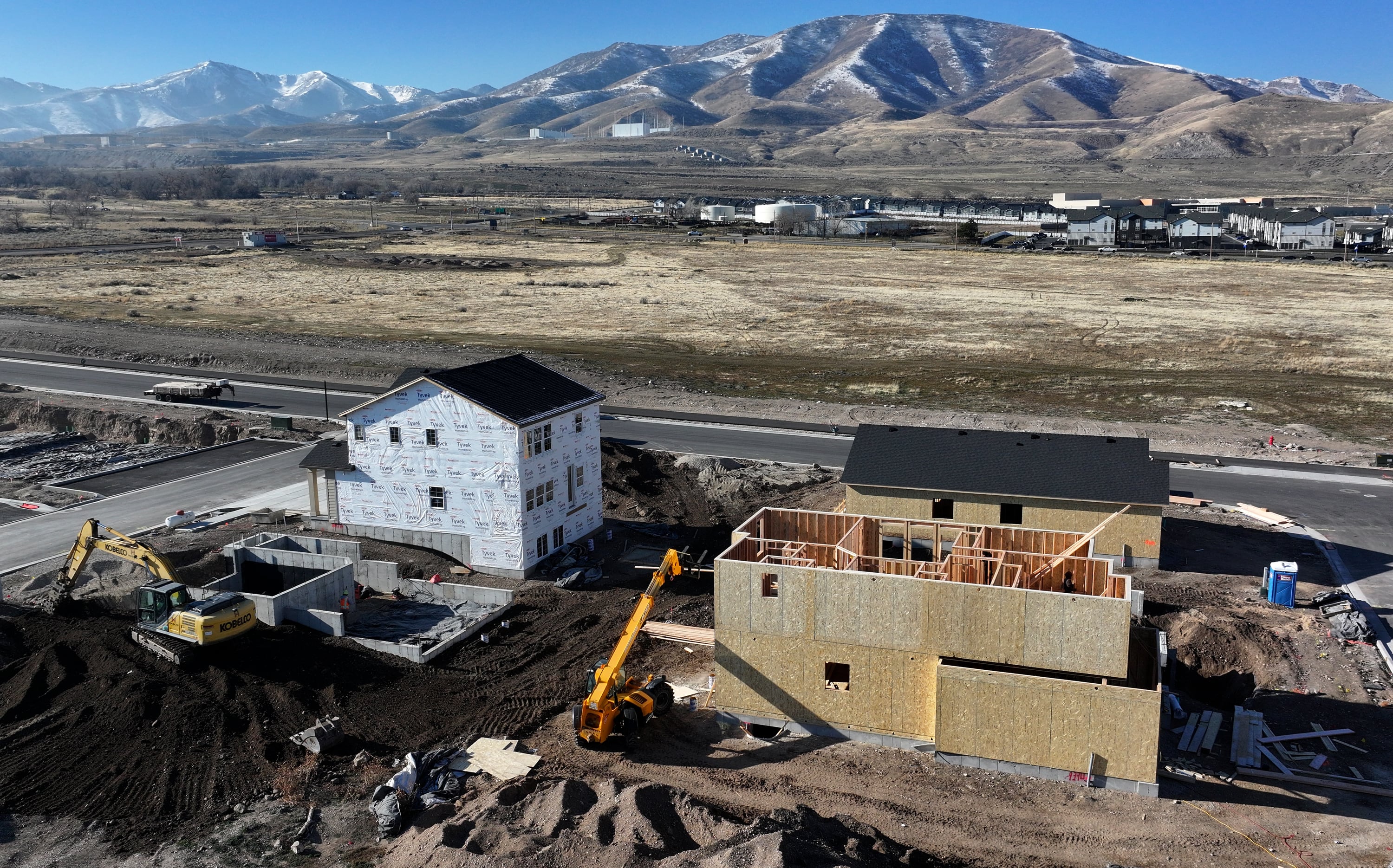 Homes under construction in the Mahogany Ridge development in Magna on Dec. 30. Economic uncertainty and inflation are continuing to raise home prices higher, Redfin said in a new report.