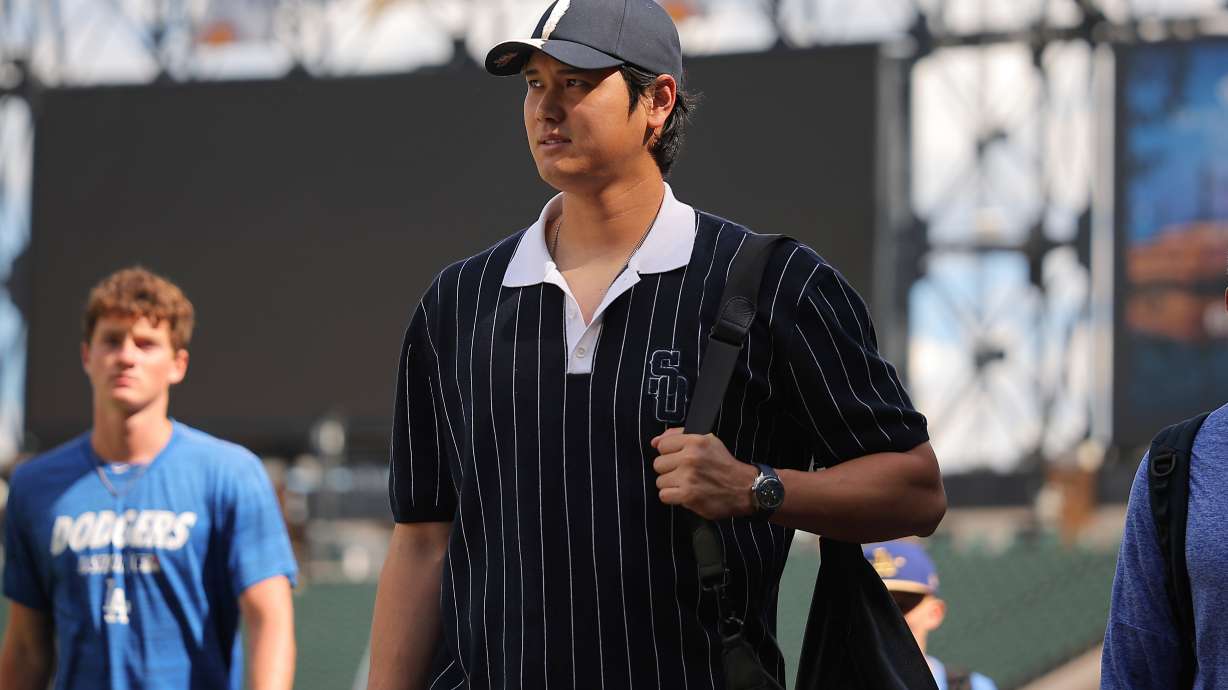 Los Angeles Dodgers' Shohei Ohtani enters the field prior to a baseball game against the Chicago White Sox, Friday, June 12, 2026, in Chicago.
