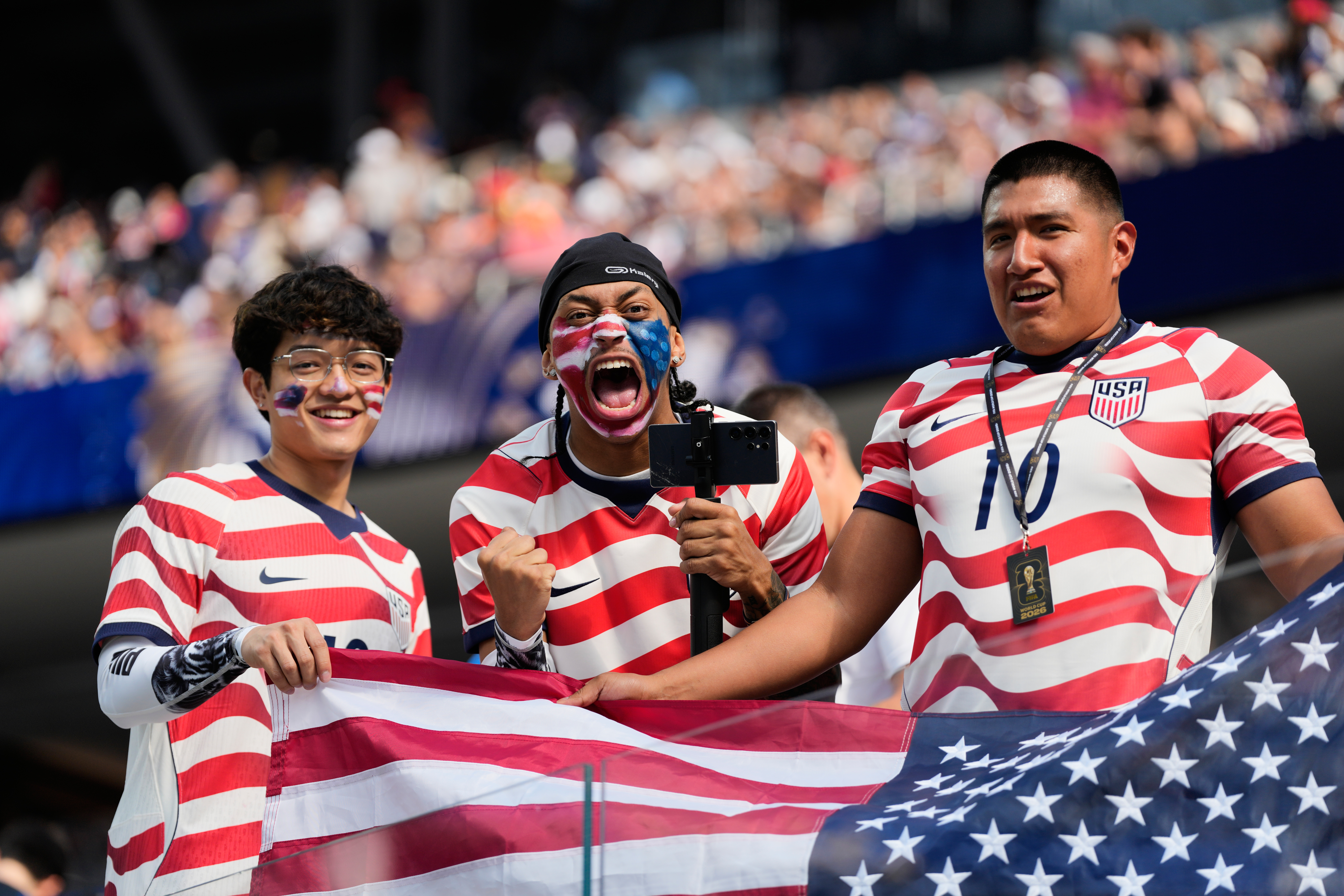 Roaring crowds in stars and stripes show up for the US team, and soccer's moment in their country