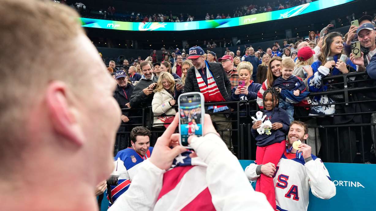 FILE - United States' Jaccob Slavin (74) poses with his gold medal after the men's ice hockey gold medal game between Canada and the United States at the 2026 Winter Olympics, in Milan, Italy, Feb. 22, 2026.