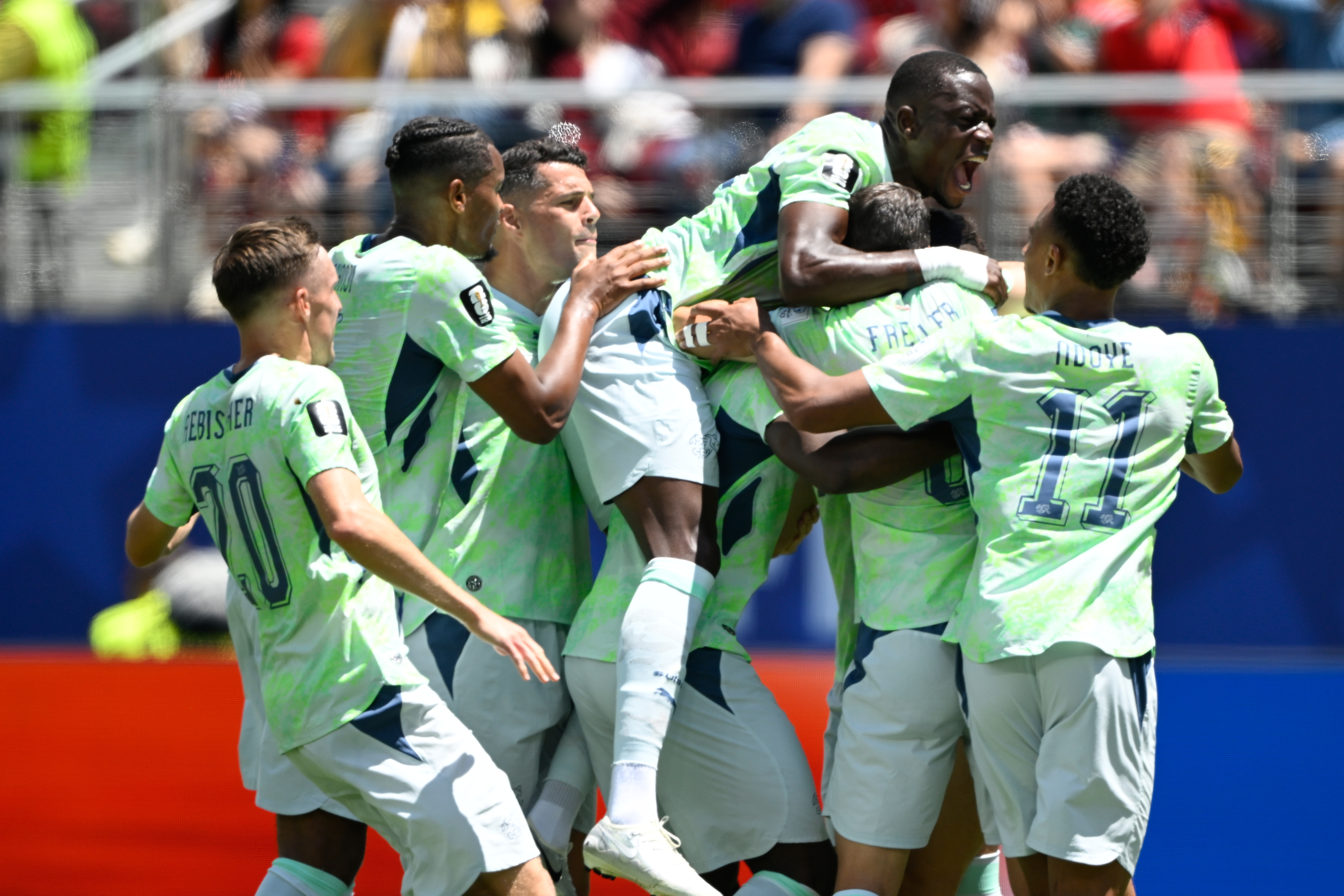 Boualem Khoukhi's goal on header in stoppage time earns Qatar a 1-1 World Cup draw with Switzerland