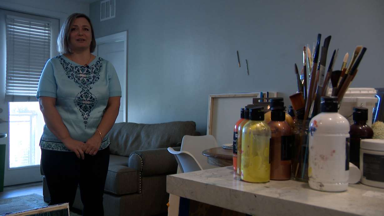 Olha Svieshnikova stands in her Sandy apartment near her art supplies on Friday. Svieshnikova is currently competing in an art competition.