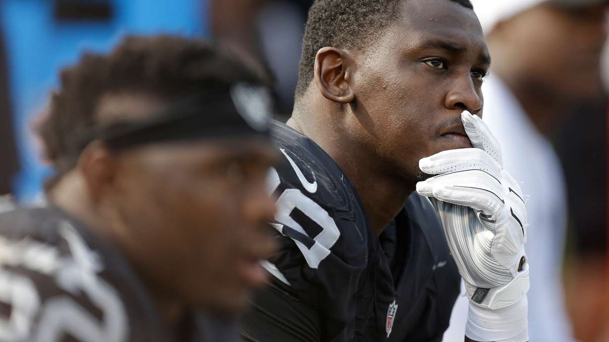 FILE - Oakland Raiders linebacker Aldon Smith (99) sits on the bench during the second half of the team's NFL football game against the Cincinnati Bengals in Oakland, Calif., on Sept. 13, 2015.