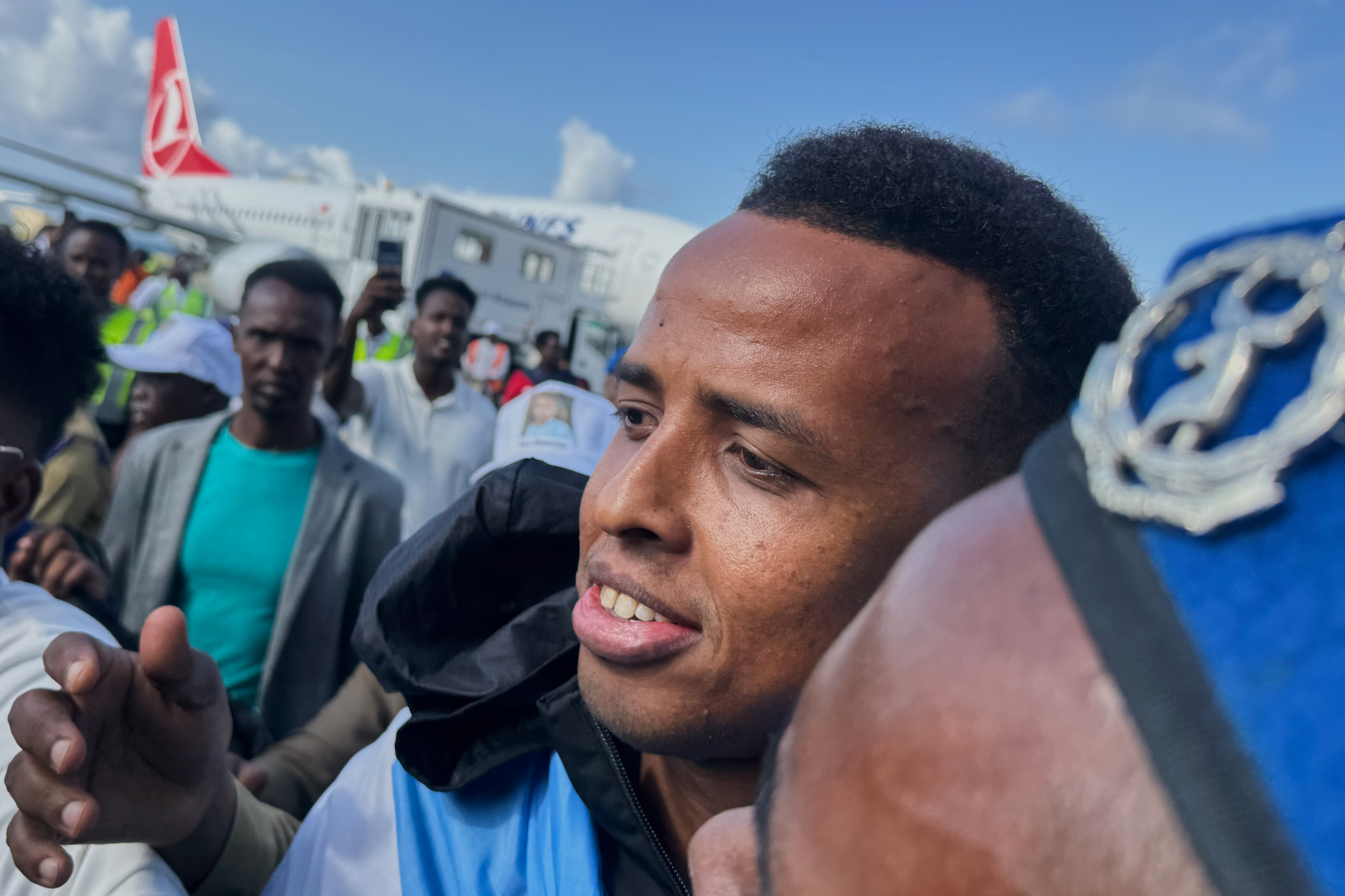 Referee Omar Artan, who was denied entry to the United States, is welcomed by supporters upon his arrival in Mogadishu, Somalia, Wednesday, June 10, 2026. 